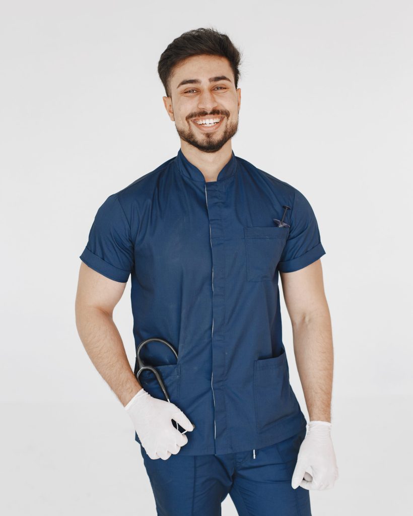 International medical student. Man in a blue uniform. Doctor with stethoscope.